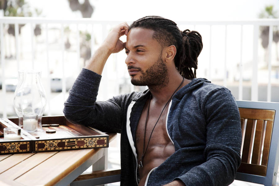 Riveting Portrait Of Brandon Mclaren Showcasing His Dreadlocks Wallpaper