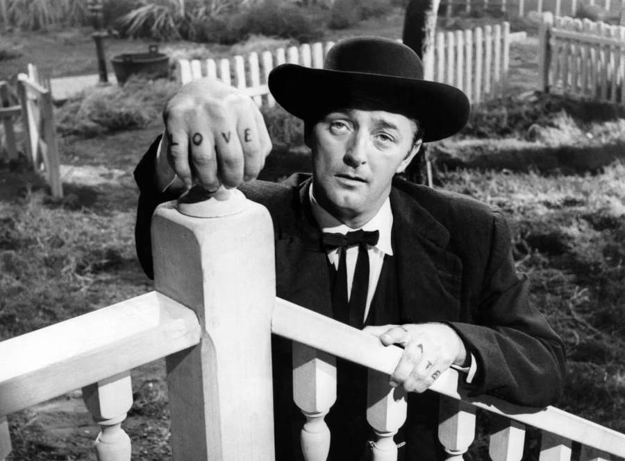 Robert Mitchum Black And White By Railing Wallpaper