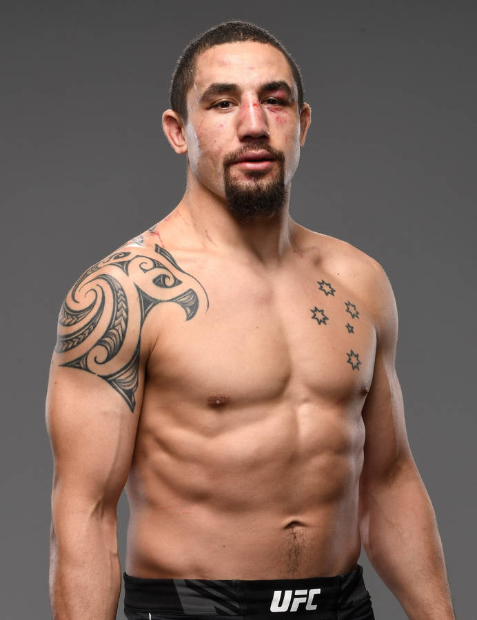 Robert Whittaker In Gray Background Wallpaper