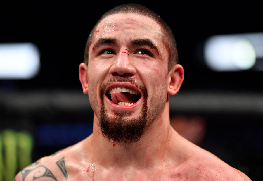 Robert Whittaker With Tongue Out Wallpaper