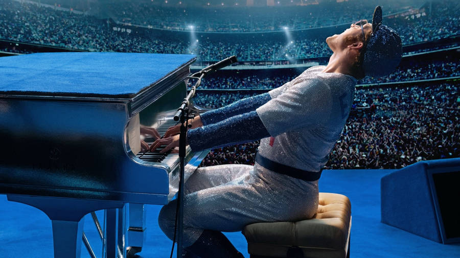 Rocketman Lively Performance Playing Piano Wallpaper