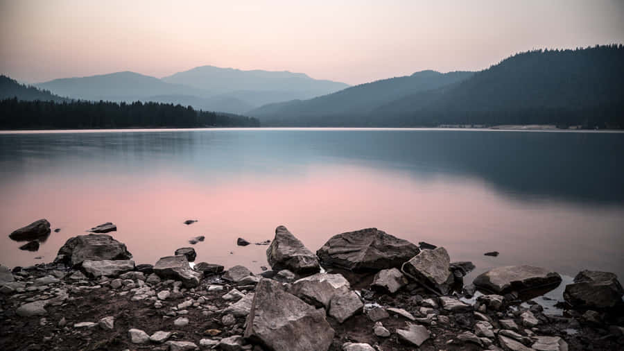 Rocky Lakeshore Calms Wallpaper