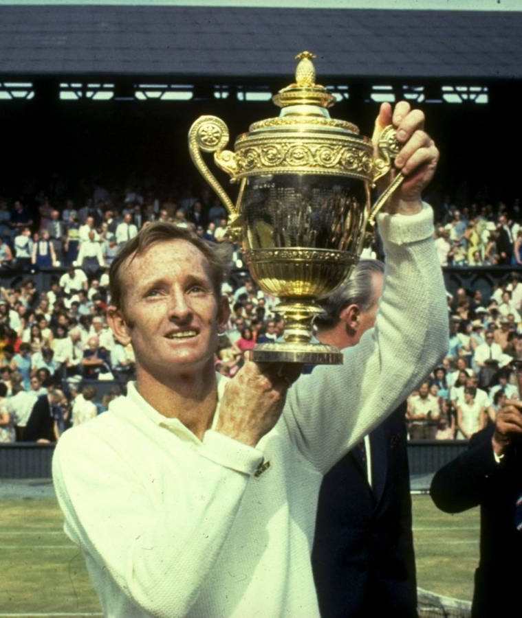 Rod Laver Lifting 1968 Wimbledon Trophy Wallpaper