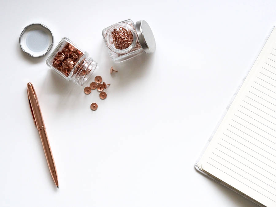 Rose Gold Thumbtacks And Pens Wallpaper