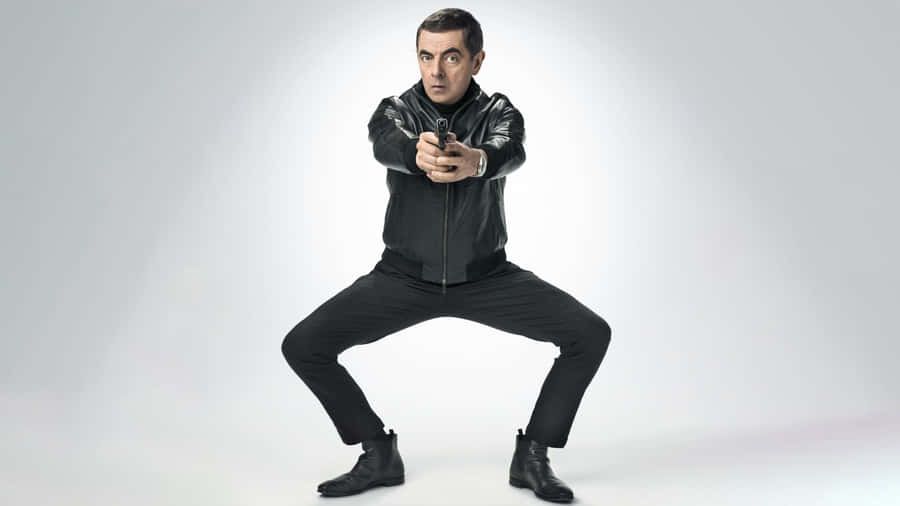 Rowan Atkinson Action Pose Wallpaper