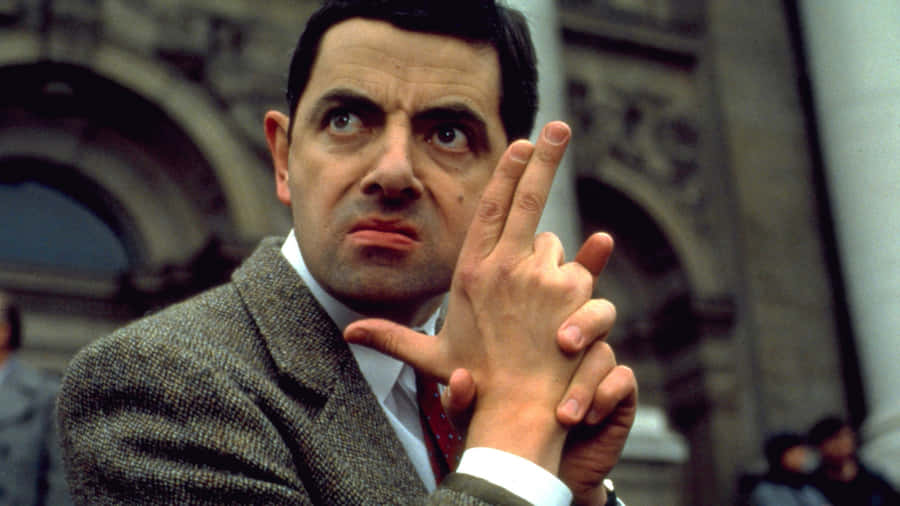 Rowan Atkinson Comedic Gesture Wallpaper