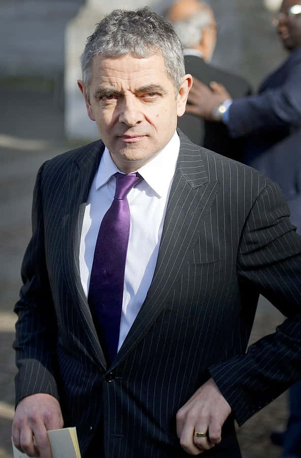 Rowan Atkinson Serious Businessman Look Wallpaper