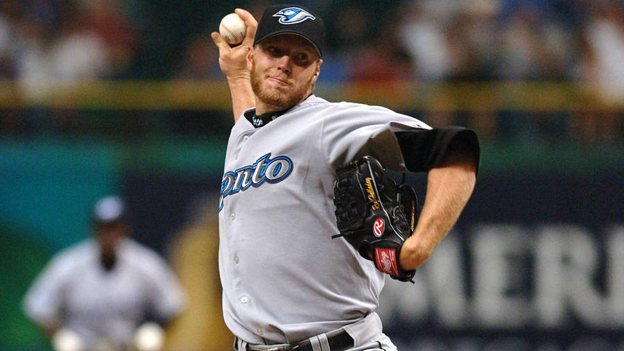Roy Halladay Throwing Baseball While Holding Glove Wallpaper
