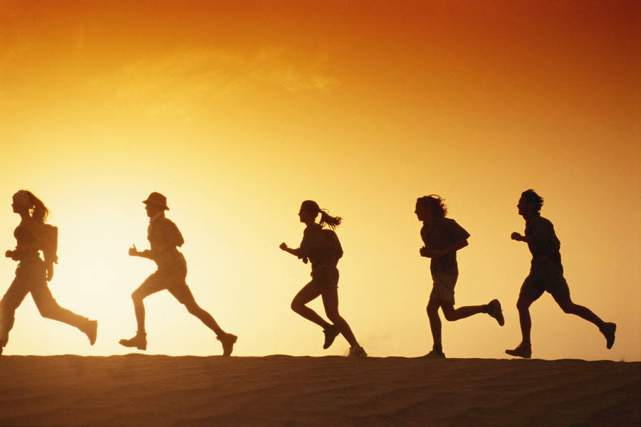 Running People Against Sunset Wallpaper