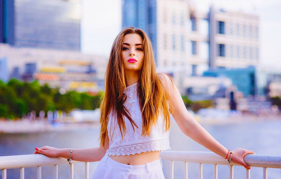 Russian Girl Posing Against Railing Wallpaper