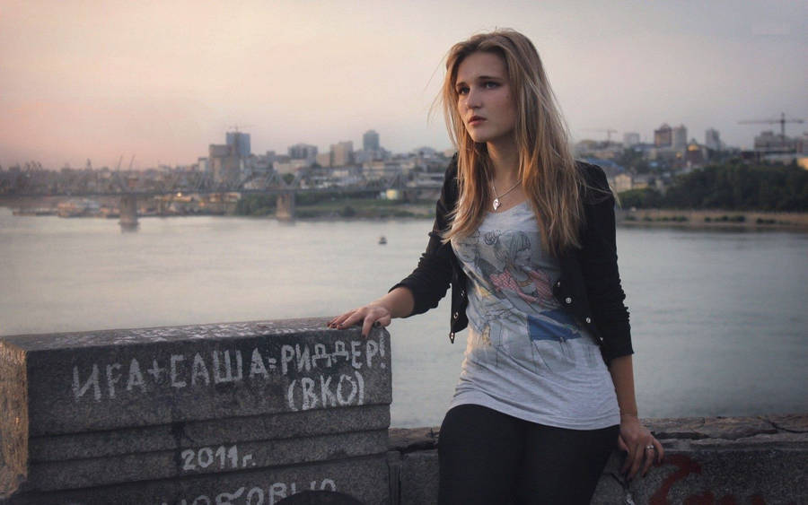 Russian Girl Sitting On A Concrete Wall Wallpaper