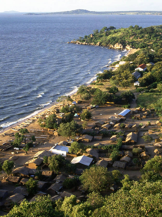 Rustic Houses Near Lake In Malawi Wallpaper