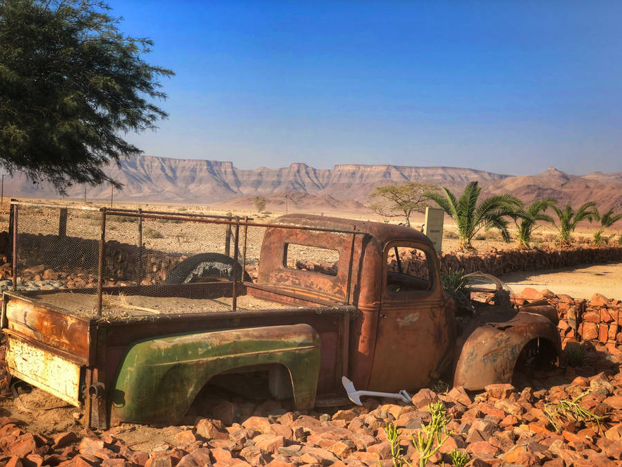 Rusty Truck In The Desert In Namibia Wallpaper