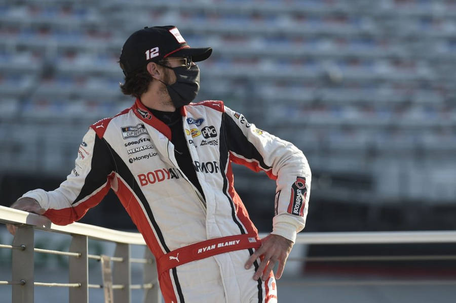 Ryan Blaney Leaning On Metal Railway Wallpaper