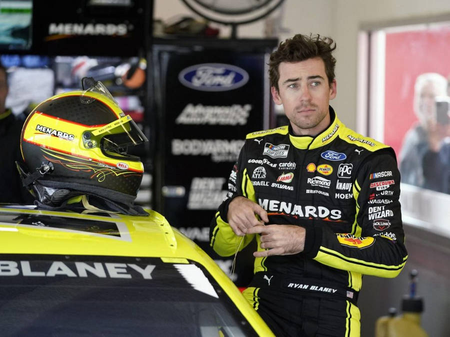 Ryan Blaney Standing Beside Race Car Wallpaper