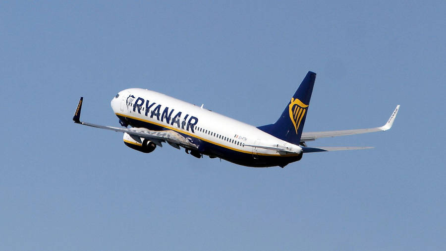 Ryanair Aircraft Soaring Through The Sky Wallpaper