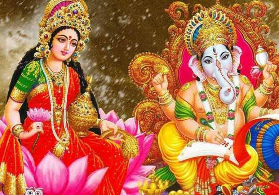 Sacred Aura Of Lord Ganesh And Goddess Lakshmi Wallpaper