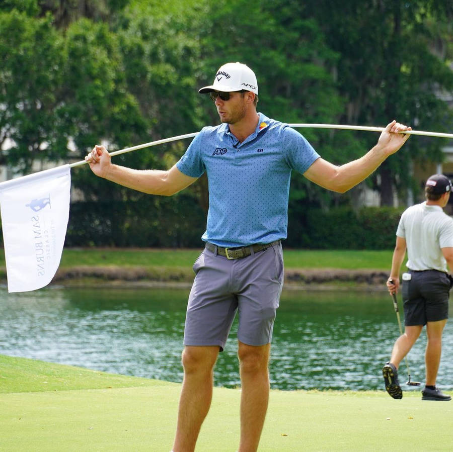 Sam Burns Carrying White Golf Flag Wallpaper