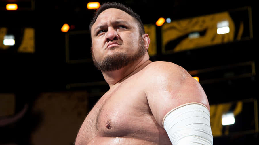 Samoa Joe Showcasing His Fierce Persona In An Aew Match Wallpaper