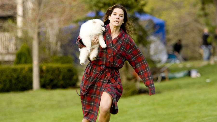 Sandra Bullock Holding A Puppy Wallpaper