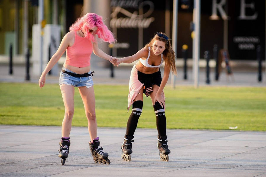 Sandra Kubicka And Friend Rollerblading Wallpaper