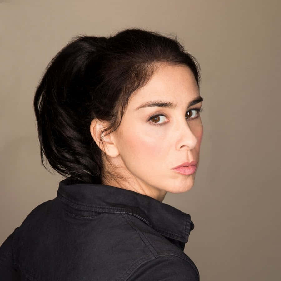 Sarah Silverman Striking A Pose On A Red Background Wallpaper