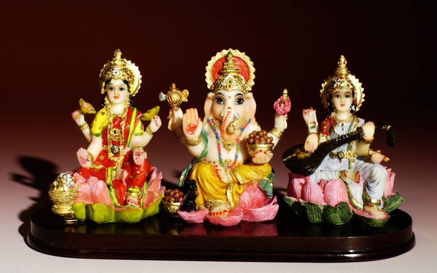 Saraswati Ganesh Laxmi Statues Wallpaper