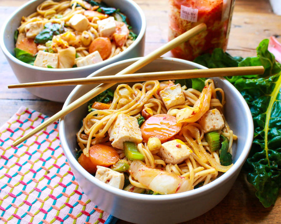 Satisfying Bowl Of Noodles Topped With Flavorful Kimchi Wallpaper