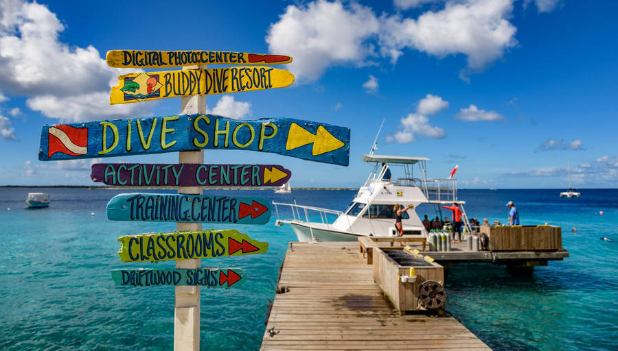 Scenic Bonaire Dive Shop Overlooking The Blue Sea Wallpaper