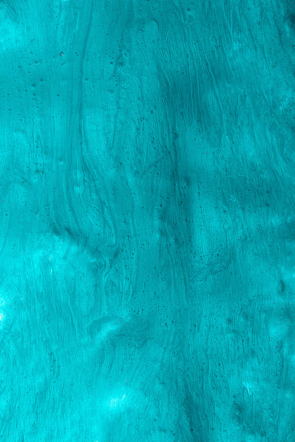 Seamless Integration Of Style And Technology With The Turquoise Iphone Wallpaper