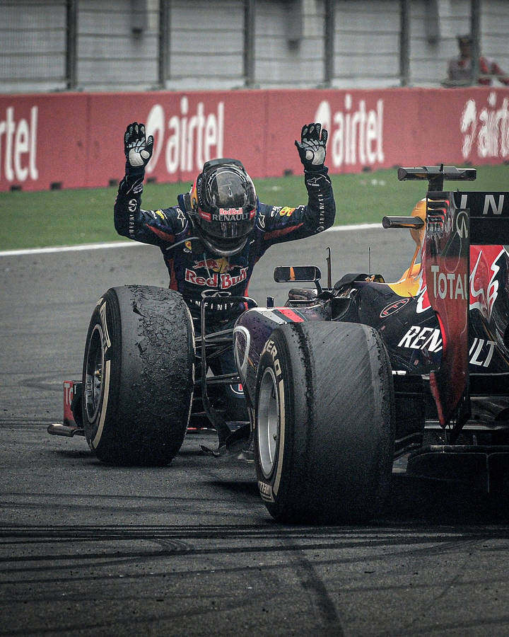 Sebastian Vettel Kneeling On The Track Wallpaper