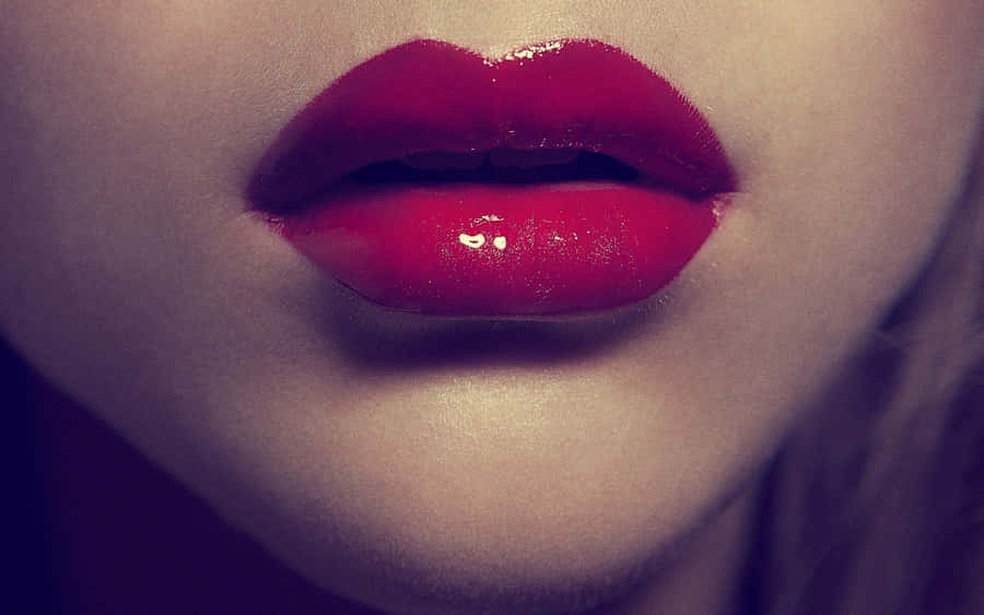 Seductive Red Lips On A Mesmerizing Face Wallpaper