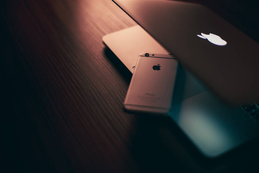 Serene Aesthetic Of An Apple Mac Placed In A Harmoniously Organized Workspace. Wallpaper