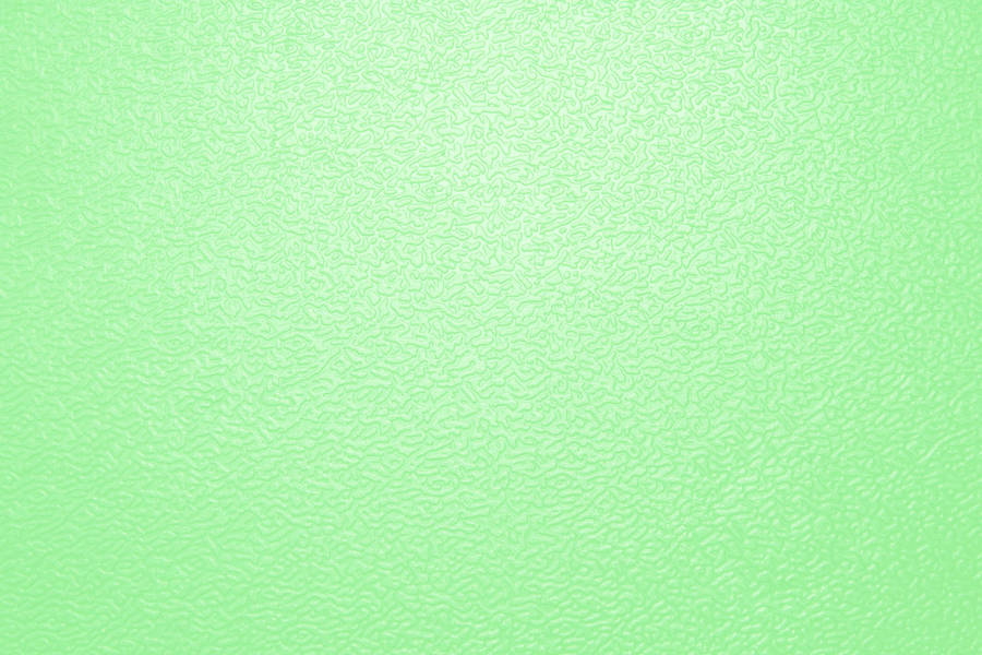 Serene Light Green Pebbled Surface Background Wallpaper