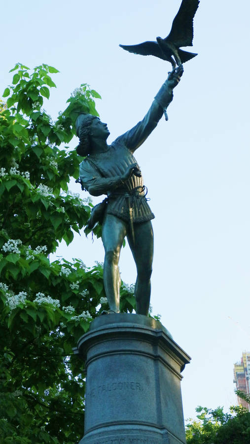 Serene Statue Amidst Nature In Central Park Wallpaper