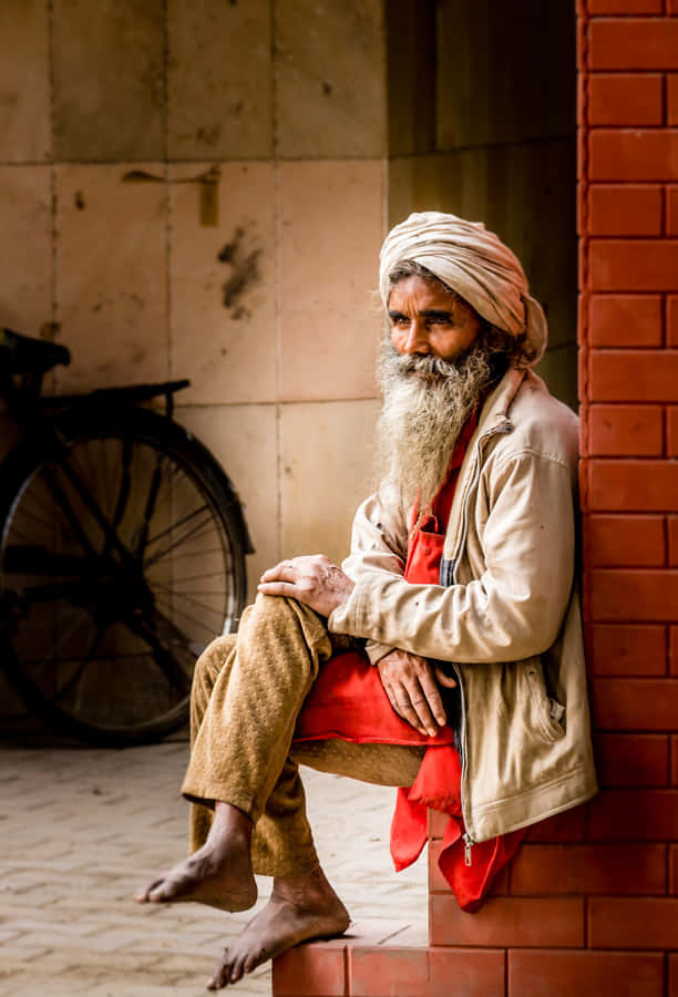 Serenity And Wisdom - A Mature Indian Man With Traditional Turban Wallpaper