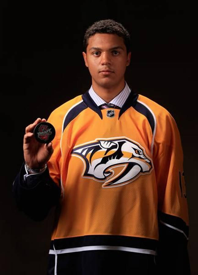 Seth Jones With Draft Hockey Puck Wallpaper