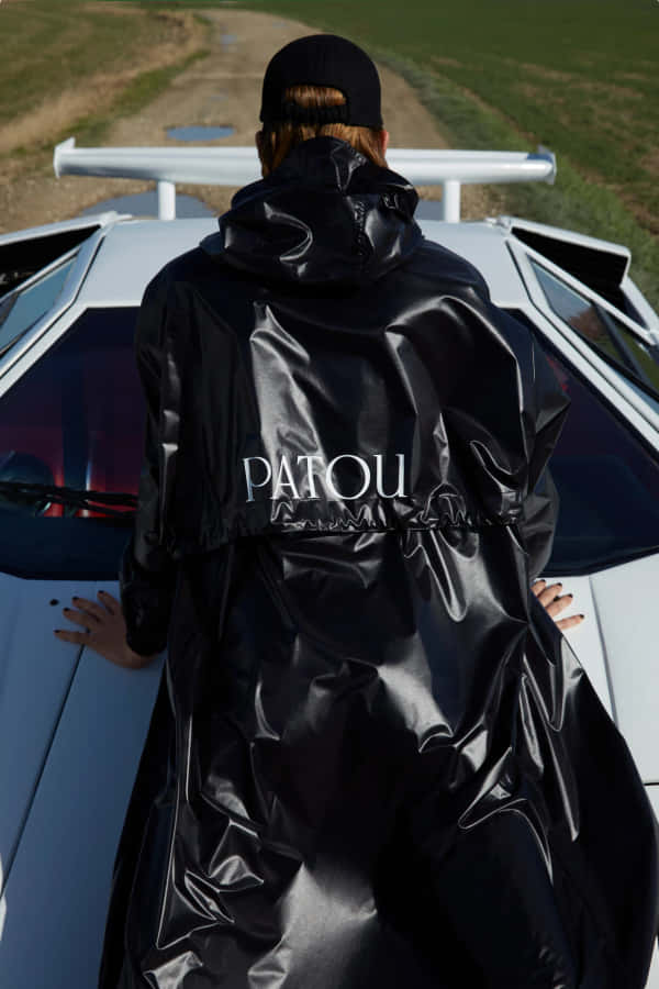Shiny Black Patou Outfit With Car Wallpaper