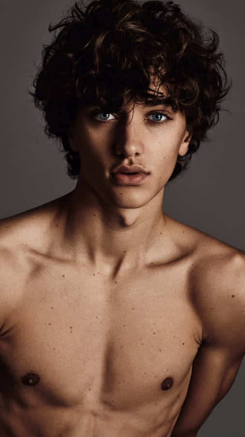 Shirtless Young Manwith Curly Hair Wallpaper