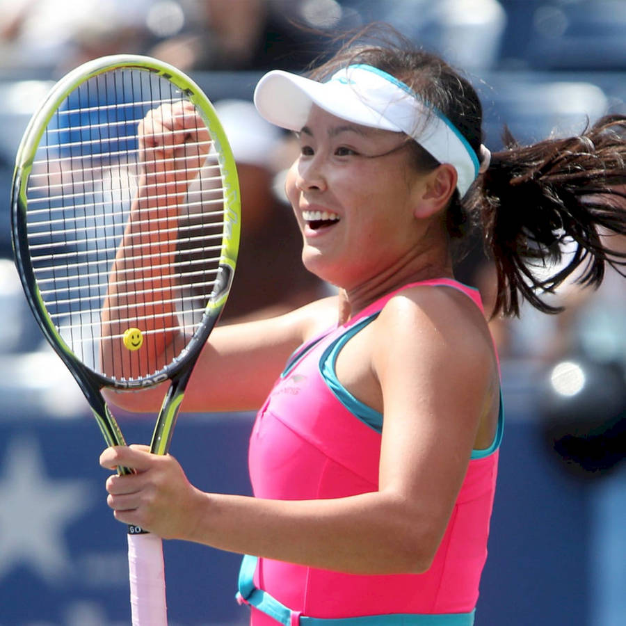 Shuai Peng Exuberantly Celebrating On The Tennis Court Wallpaper