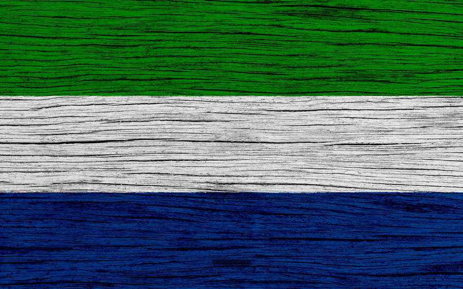 Sierra Leone Flag On Wooden Surface Wallpaper