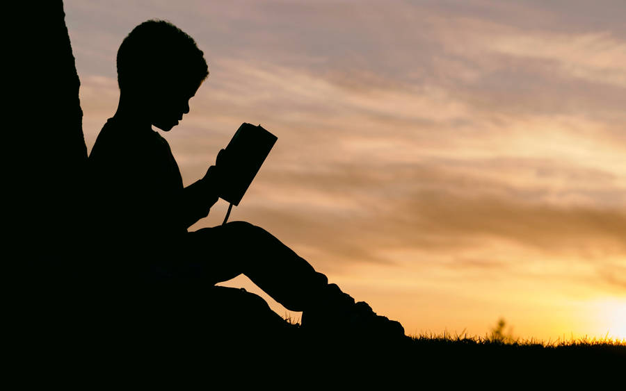 Silhouette Boy Reading Book Wallpaper