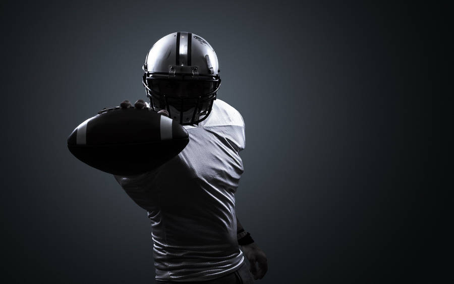 Silhouette Of Man From Sports Football Wallpaper