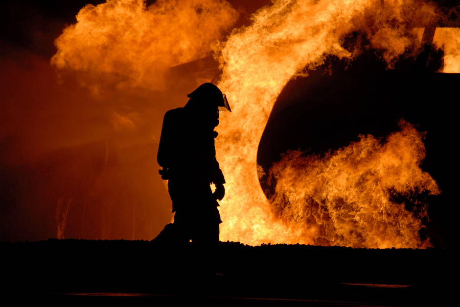 Silhouette Of Walking Firefighters Wallpaper