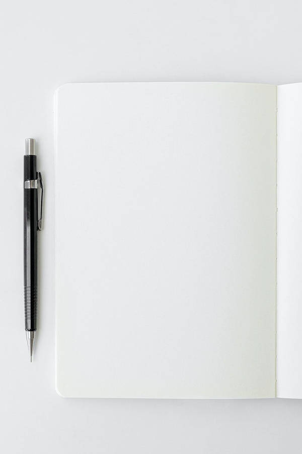 Silver Pen On A Blank Page Wallpaper