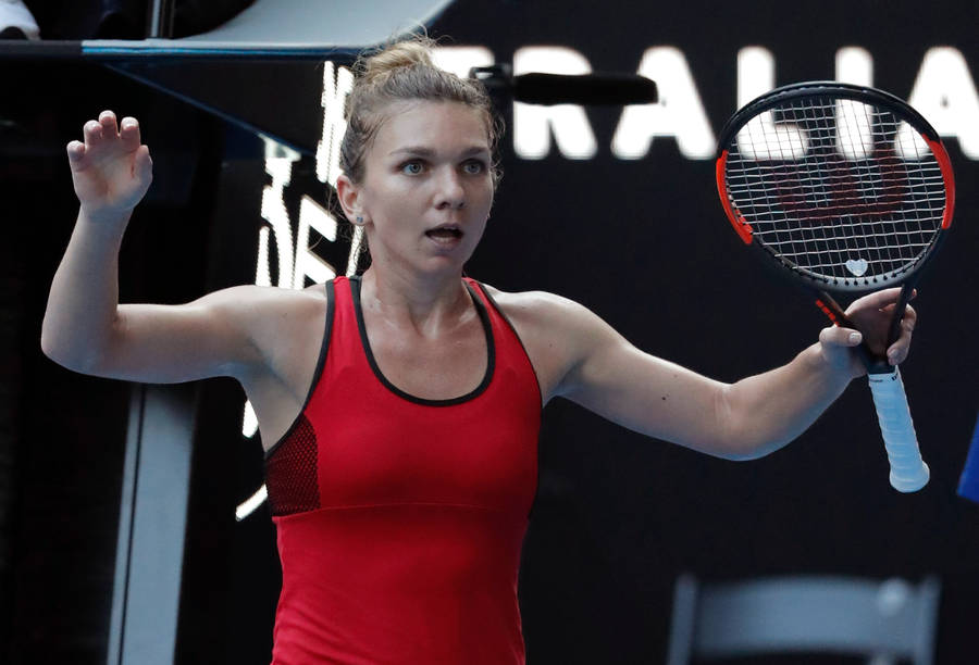 Simona Halep: Tennis Champion In Action Wallpaper