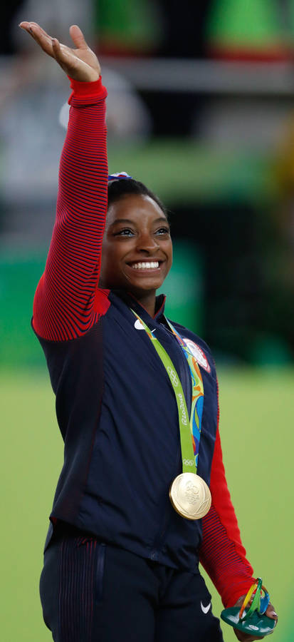 Simone Biles Waving Wallpaper