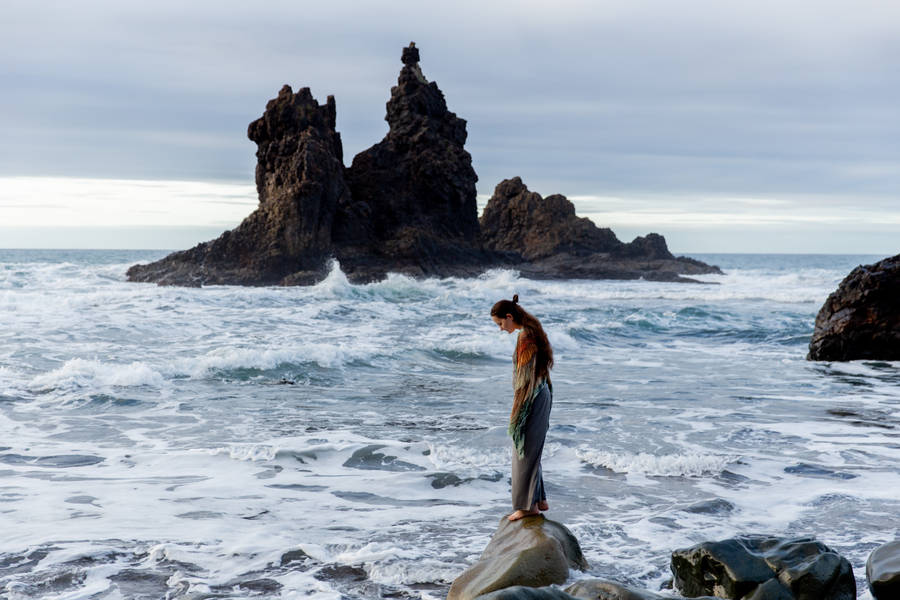 Single Girl On Rock Cliffs Wallpaper