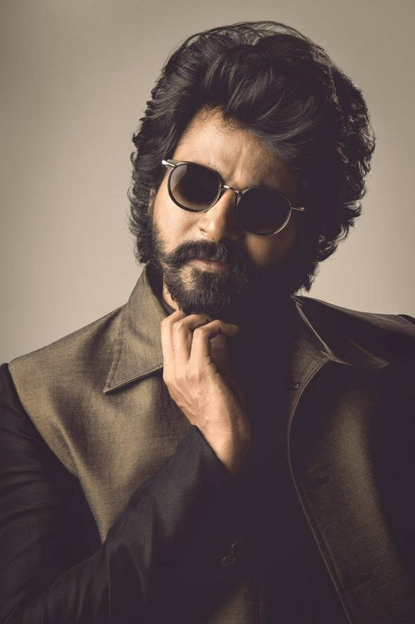 Sivakarthikeyan In Long Hair And Stylish Sunglasses Wallpaper