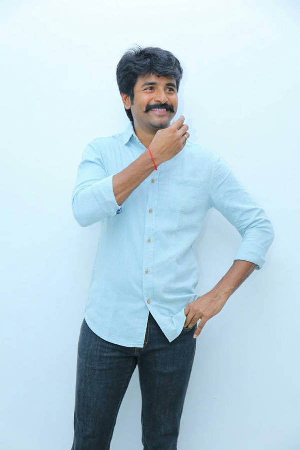 Sivakarthikeyan Posing In A Light-blue Shirt Wallpaper